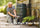Compost and soil forms the background for the text 'How to choose the perfect water butt and composter for your garden'. 