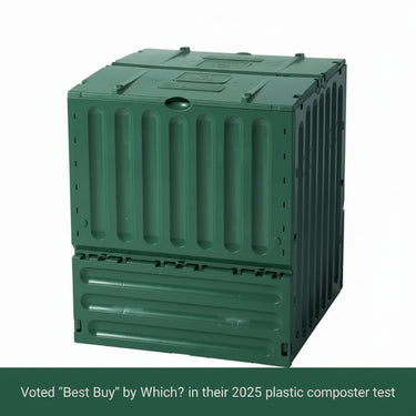 A large green rectangular compost bin made from recycled plastic with a ribbed design.