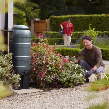Mini Rainsaver 100 Litre Green Water Butt Kit in use