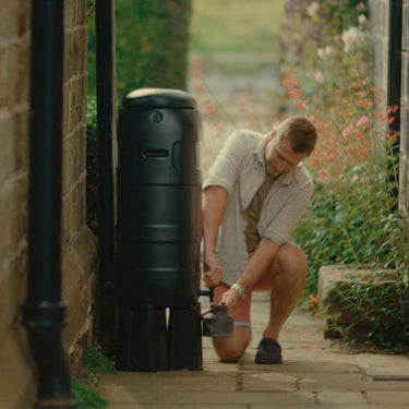 Man using Mini Rainsaver water butt